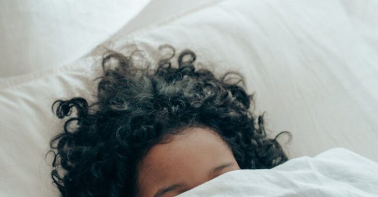 Naps - Unrecognizable person sleeping under blanket