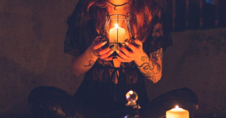 Myths - Spooky witch among candles during ritual