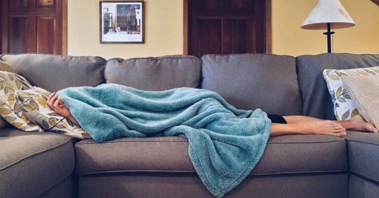 Napping - Person Lying on Sofa