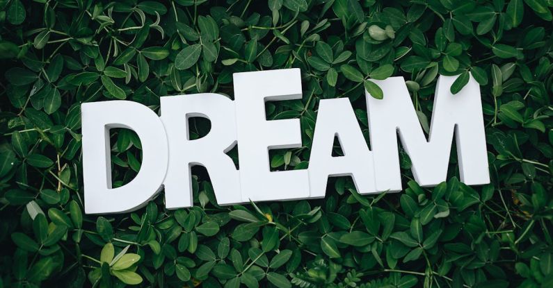 Dreams - Dream Text on Green Leaves