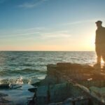 Dreams - Silhouette Photo of Man Standing Near the Edge of Concrete Pavement