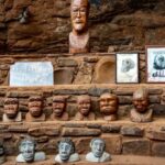 Theories - Head Carvings on a Clay and Stone Stairs