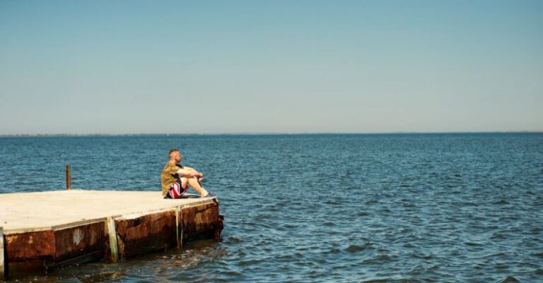 Dreams - Man Sitting on Dock