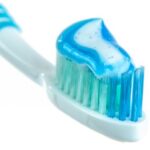 Routine - Blue and White Toothpaste on Toothbrush