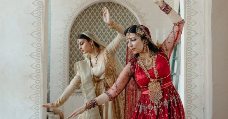 Rituals - Woman in Red Dress Standing Beside Woman in White Dress