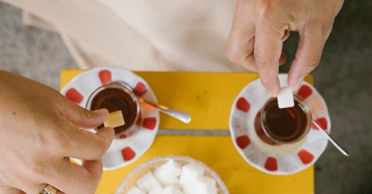 Teas - People Throwing Sugar Cubes to Teas