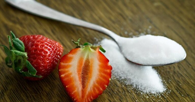 Sugar - Strawberry Beside Spoon of Sugar