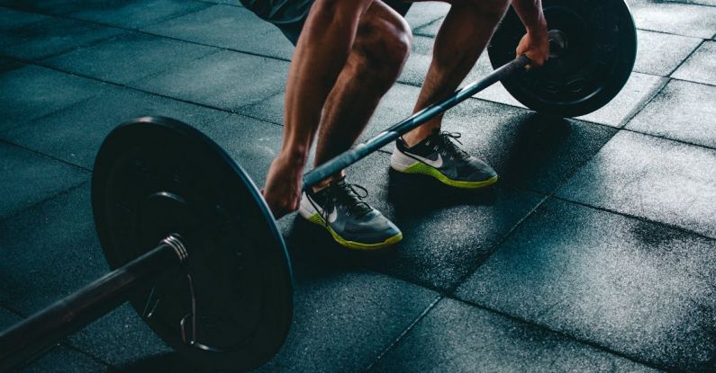 Exercise - Person Holding Barbell