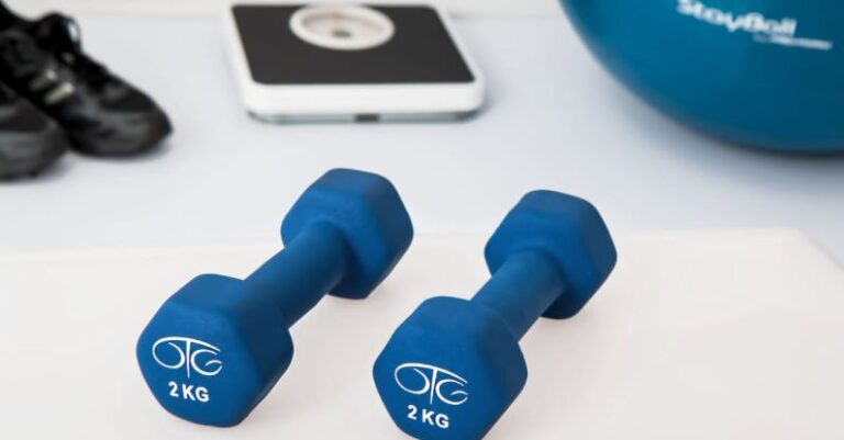 Exercises - Two 2 Kg. Blue Hex Dumbbells on White Surface